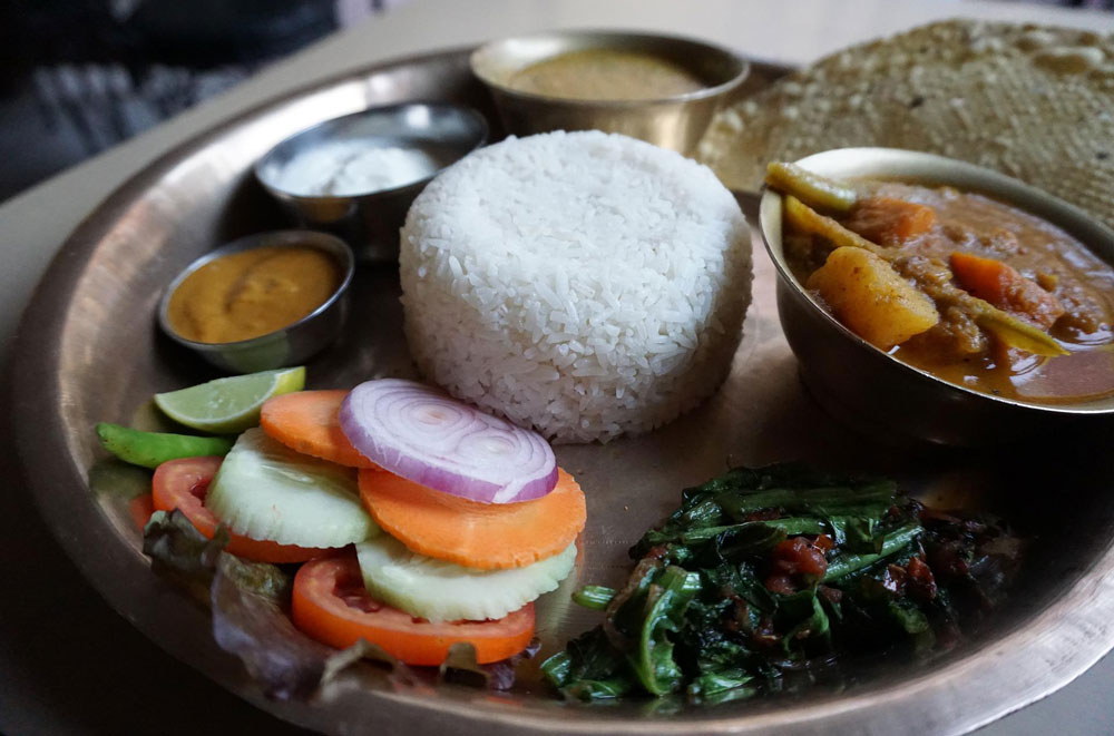 A Nepali thali makes a great Everest Base Camp trek gluten free food option for lunch and dinner. 